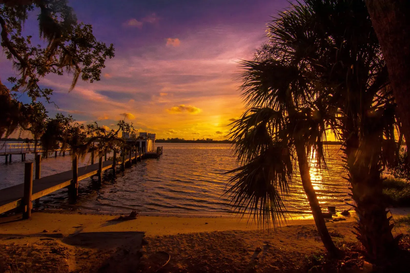 Sunset silhouette of a Florida dock, representative of Melbourne Beach, FL's southernmost barrier-island setting