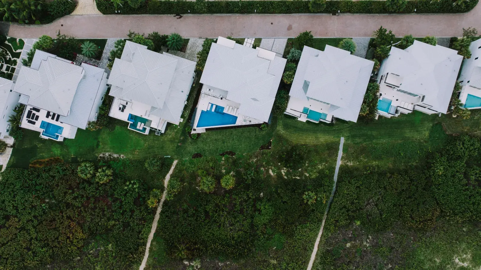 Aerial view of a suburban Florida neighborhood with pools, representative of Melbourne, FL's inland housing stock