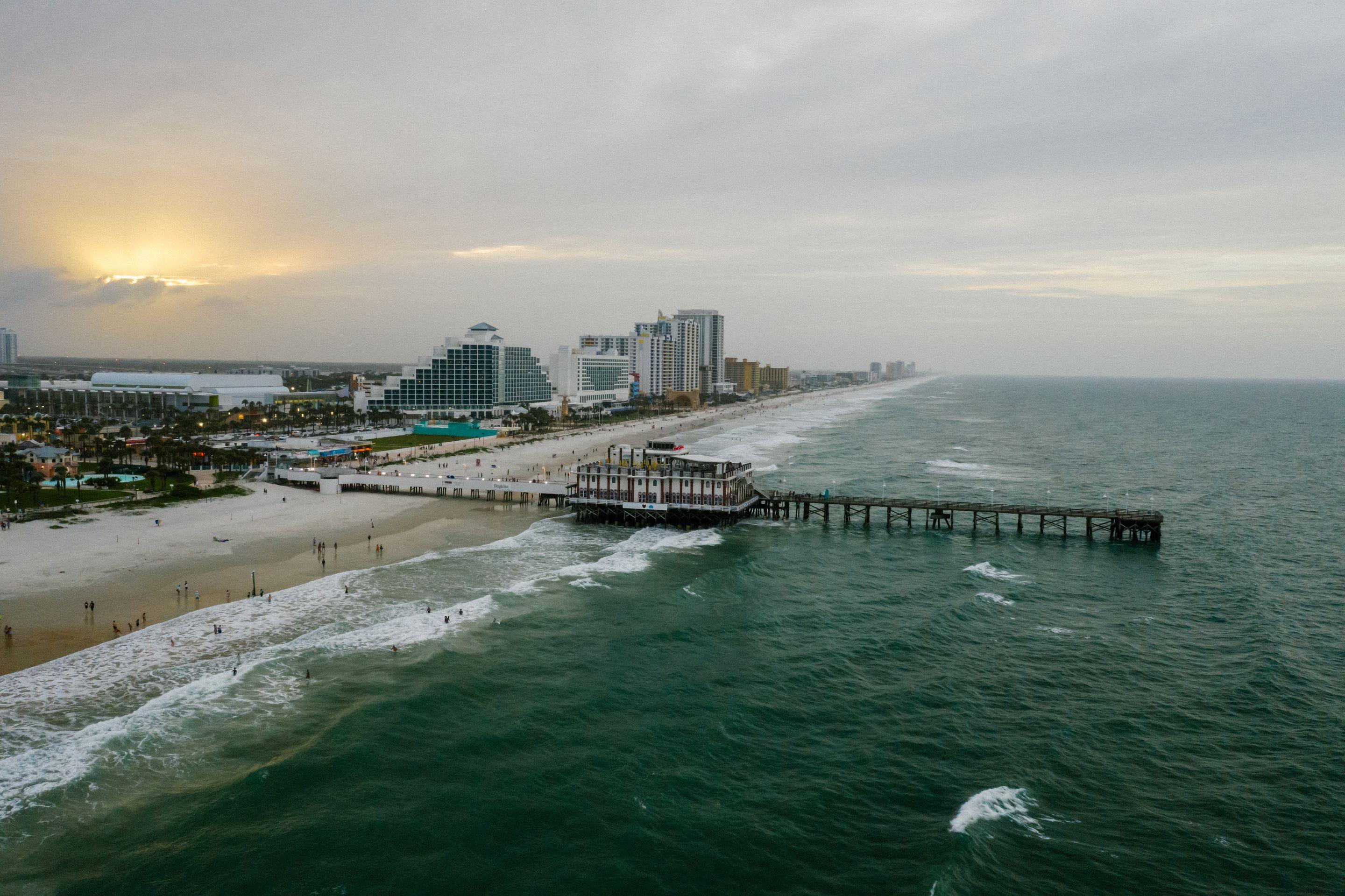 Atlantic coastline and pier at sunset, representative of Brevard County's barrier-island communities