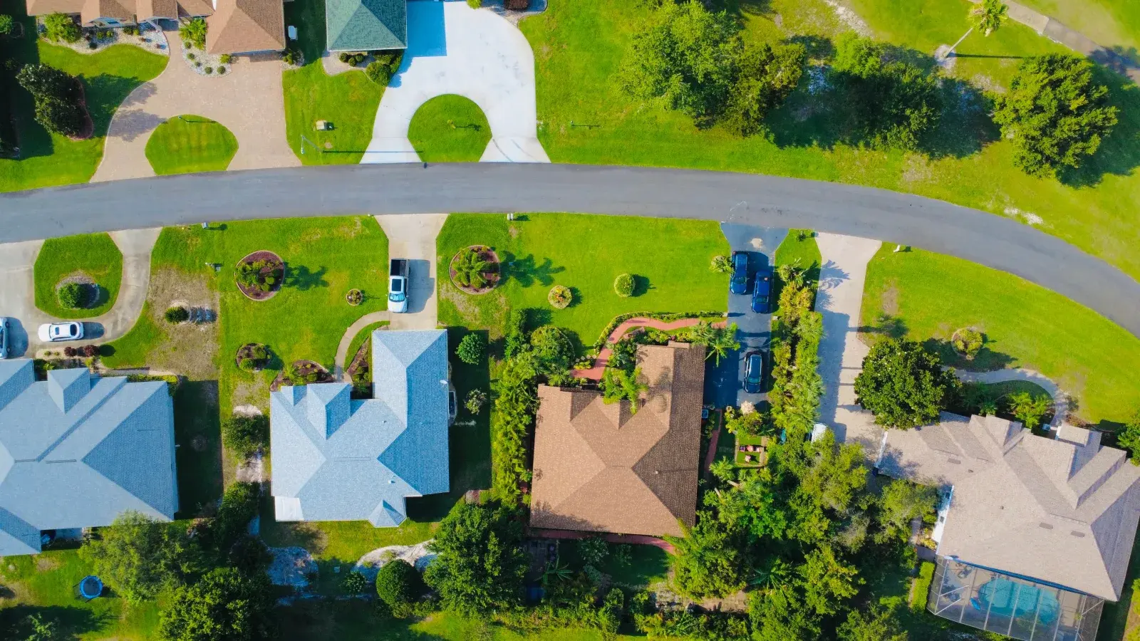 Aerial view of a suburban Florida neighborhood with green lawns, representative of Palm Bay, FL's 1980s subdivisions
